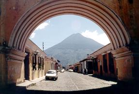 Agua Volcano through arch in Antigua, Guatemala.