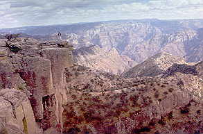 Canyon with Juan on cliff.